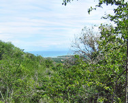 Grundstück mit Meer- und Bergblick